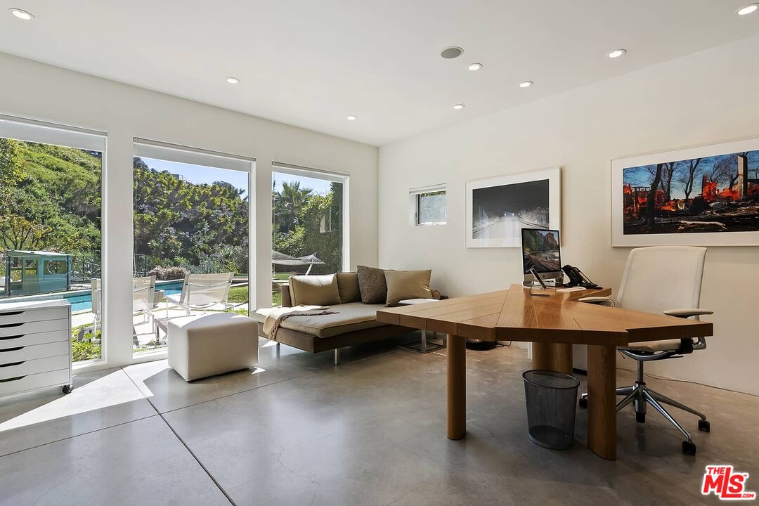 12310 Rochedale Lane Los Angeles, CA 90049 - Photo 32 of 53 a living room with furniture a flat screen tv and a large window