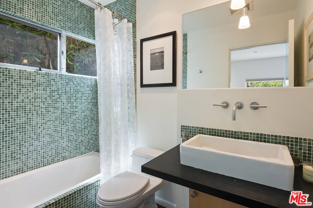 12310 Rochedale Lane Los Angeles, CA 90049 - Photo 37 of 53 a bathroom with a bathtub and a shower