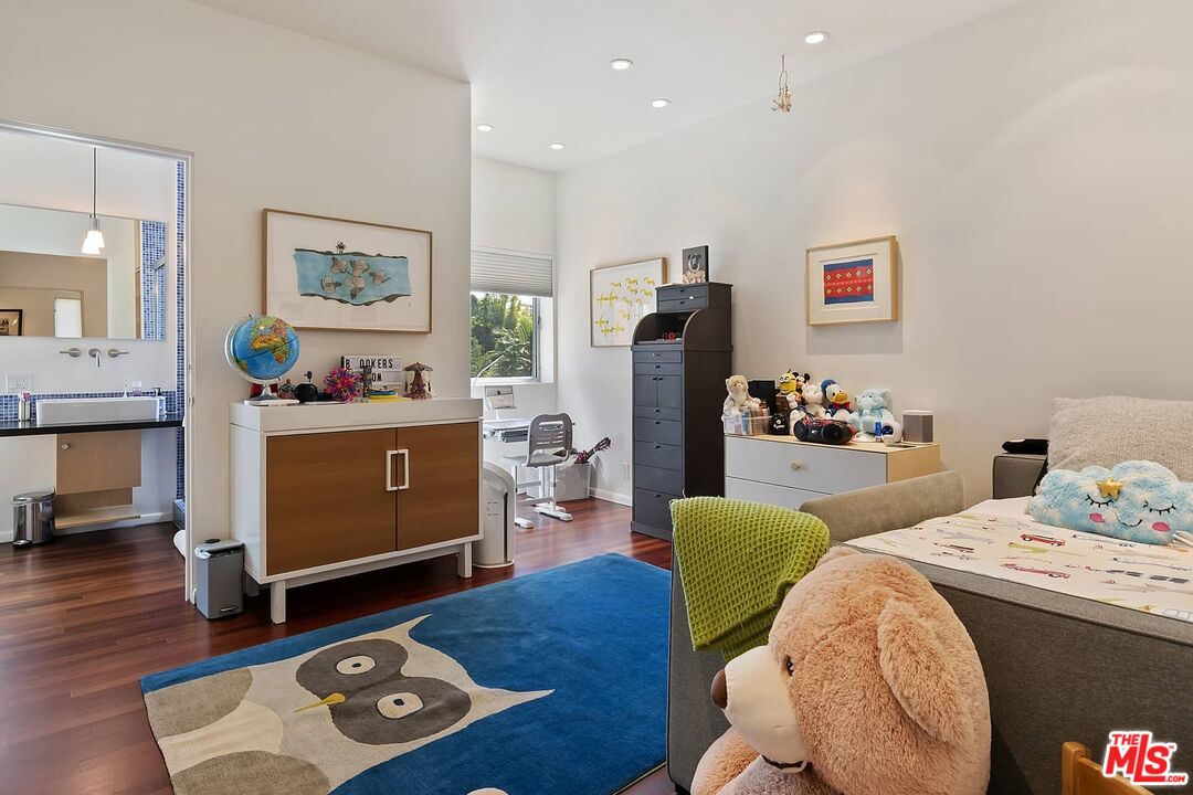12310 Rochedale Lane Los Angeles, CA 90049 - Photo 38 of 53 a living room with furniture and a flat screen tv