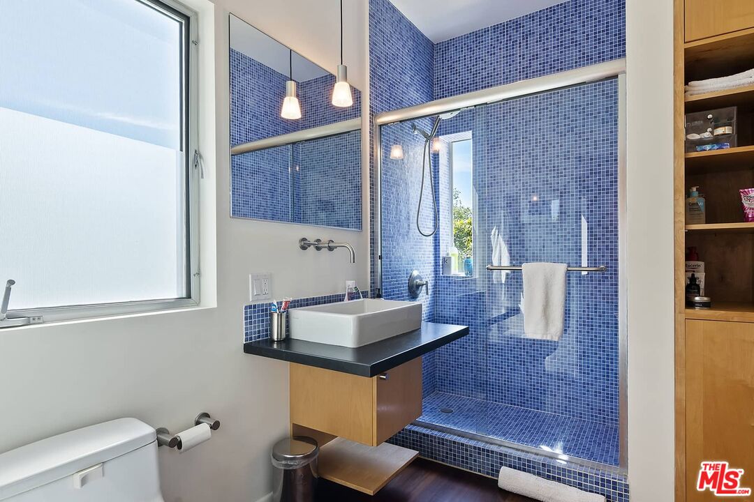 12310 Rochedale Lane Los Angeles, CA 90049 - Photo 39 of 53 a bathroom with a sink a toilet and shower