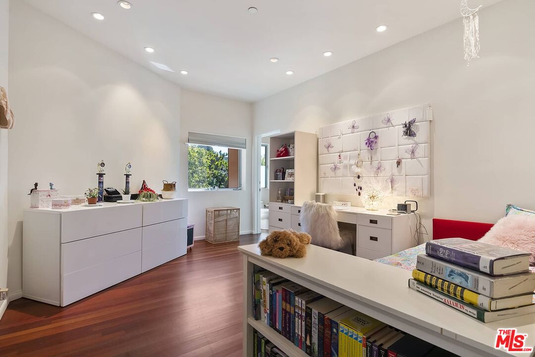 12310 Rochedale Lane Los Angeles, CA 90049 - Photo 40 of 53 a open kitchen with stainless steel appliances kitchen island granite countertop a stove a sink dishwasher and a dining table with wooden floor