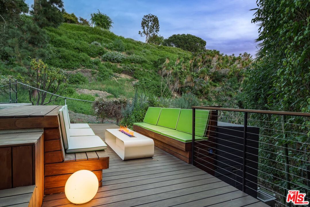 12310 Rochedale Lane Los Angeles, CA 90049 - Photo 44 of 53 a view of a roof deck with wooden floor and fence