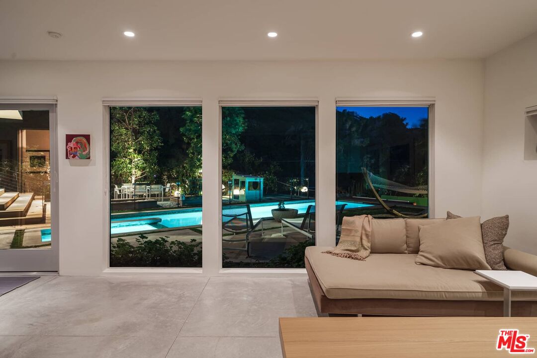 12310 Rochedale Lane Los Angeles, CA 90049 - Photo 46 of 53 a living room with furniture and a large window