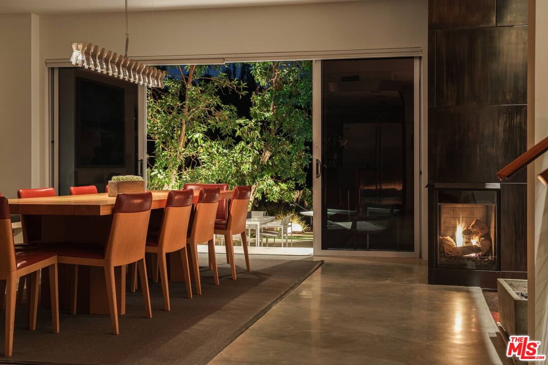 12310 Rochedale Lane Los Angeles, CA 90049 - Photo 48 of 53 a dining room with furniture and window