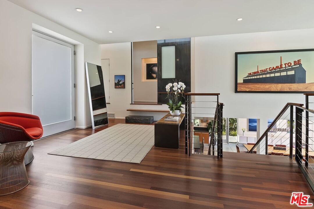 12310 Rochedale Lane Los Angeles, CA 90049 - Photo 6 of 53 a living room with furniture and a flat screen tv