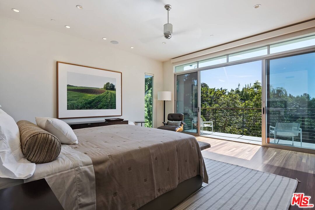 12310 Rochedale Lane Los Angeles, CA 90049 - Photo 8 of 53 a bedroom with a bed and large windows