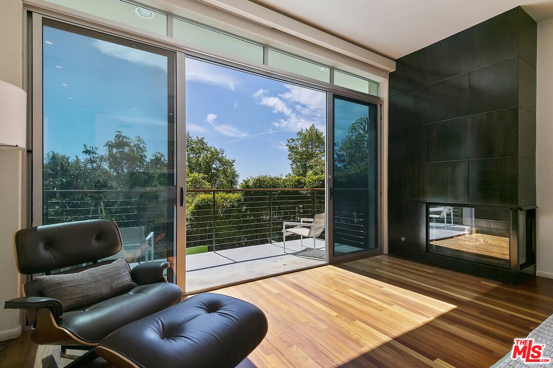 12310 Rochedale Lane Los Angeles, CA 90049 - Photo 9 of 53 a bedroom with furniture and a floor to ceiling window