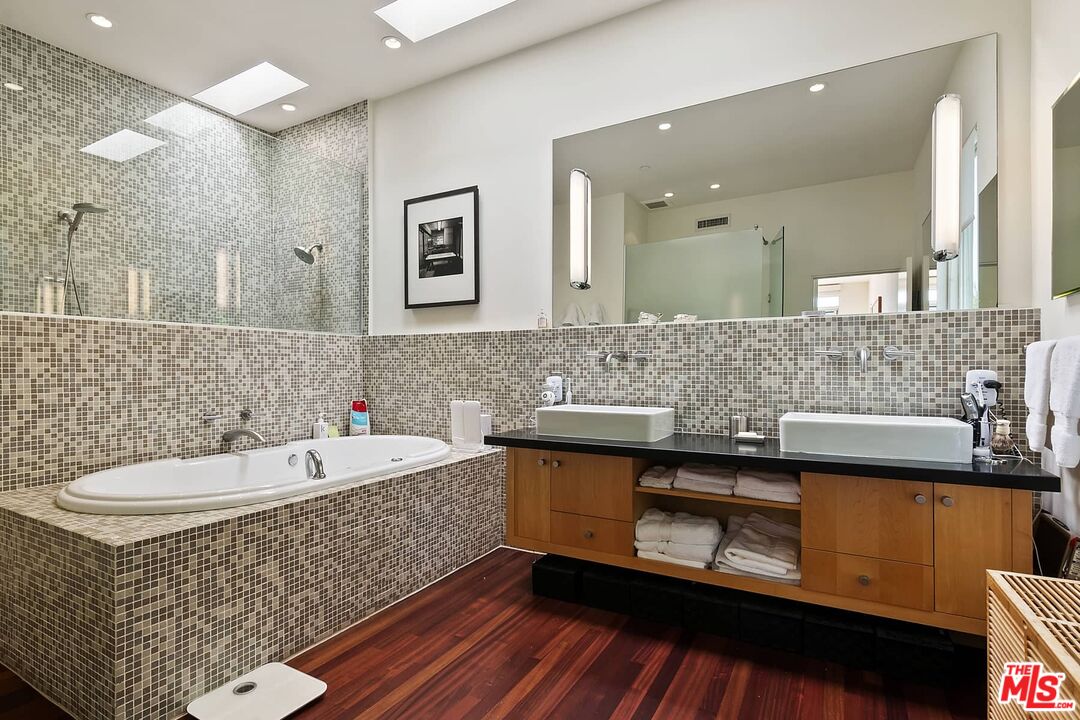 12310 Rochedale Lane Los Angeles, CA 90049 - Photo 10 of 53 a bathroom with a sink and a mirror