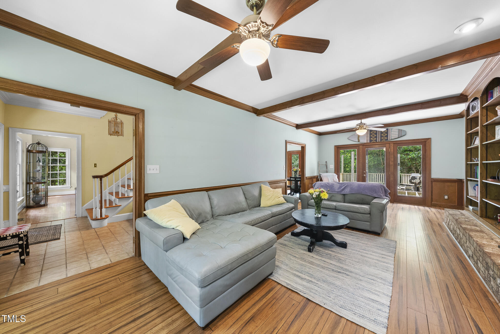 821 Ascot Lane Raleigh, NC 27615 - Photo 16 of 43 a living room with furniture and a wooden floor