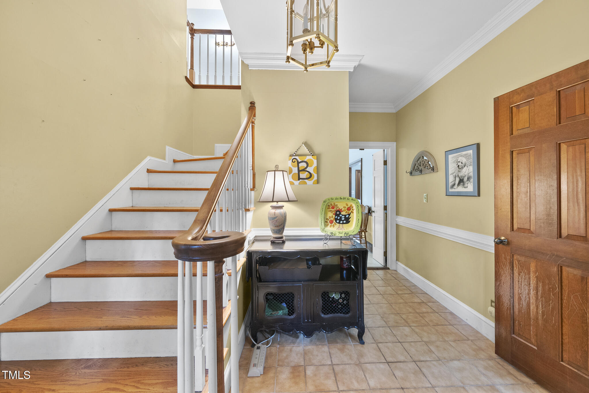 821 Ascot Lane Raleigh, NC 27615 - Photo 3 of 43 a view of entryway and hall with wooden floor