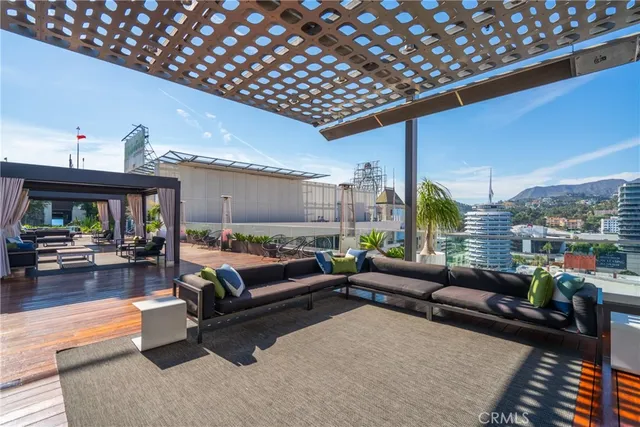 a room with gym equipment and view of living room