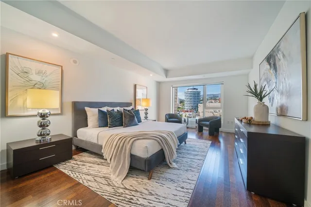 a bathroom with a sink mirror and toilet