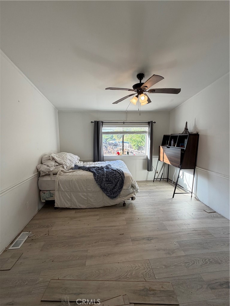 4047 Foothill Drive Lucerne, CA 95458 - Photo 59 of 75 a bedroom with furniture and a window
