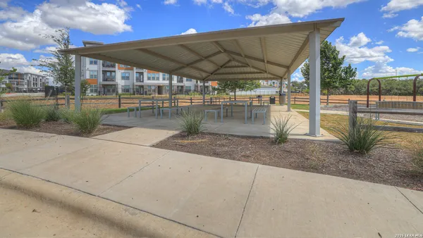 a view of a swimming pool with a patio