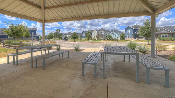 a swimming pool with outdoor seating