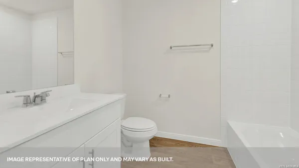a bathroom with a sink a toilet and a bathtub