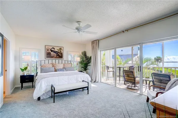 a large room with a couch and a large window