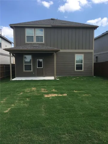 a brick house with a yard