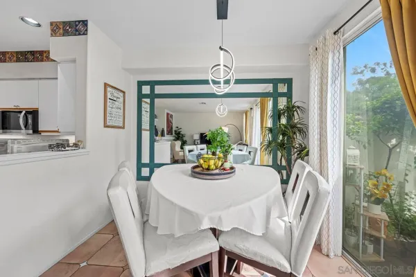 a view of a dining room with furniture window and outside view