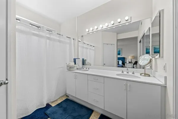 a bathroom with a double vanity sink mirror and double
