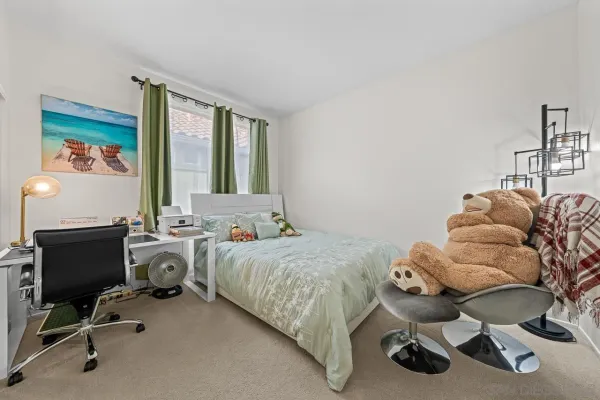 a bedroom with furniture and a window