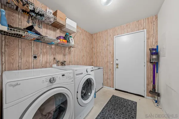 a view of livingroom with washer and dryer