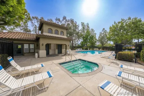 a view of a house with backyard porch and sitting area