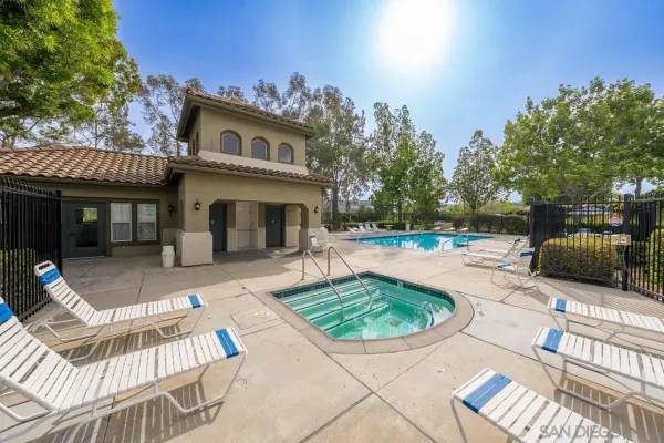 a view of a house with backyard porch and sitting area
