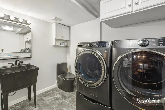 a kitchen with a sink and a mirror