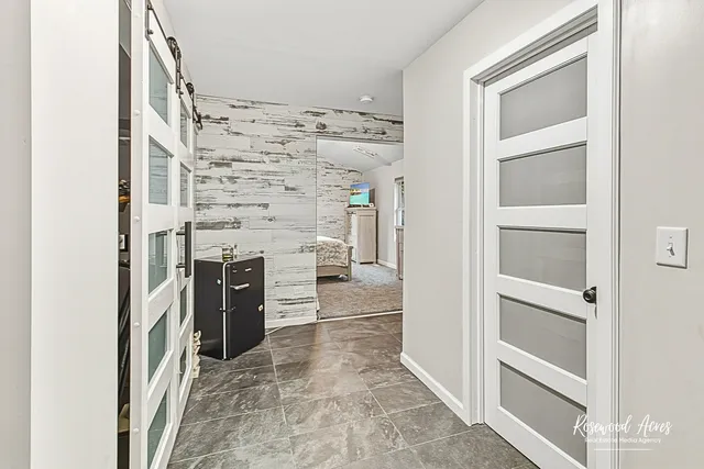 a view of an empty room and fire place