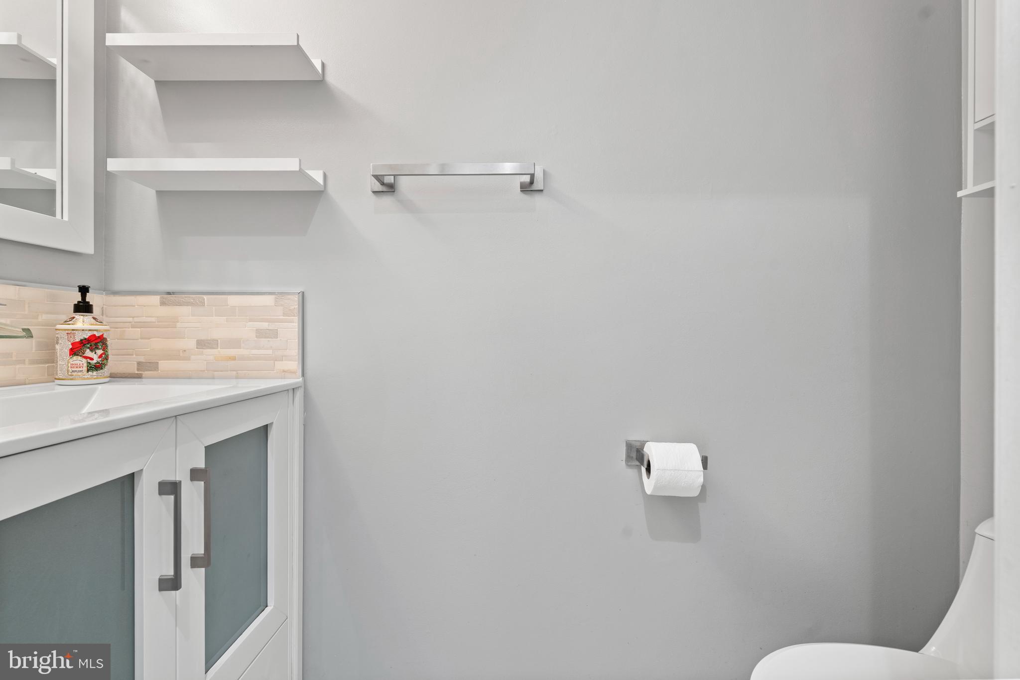 14801 Hammersmith Circle Silver Spring, MD 20906 - Photo 15 of 29 a bathroom with a sink toilet and vanity