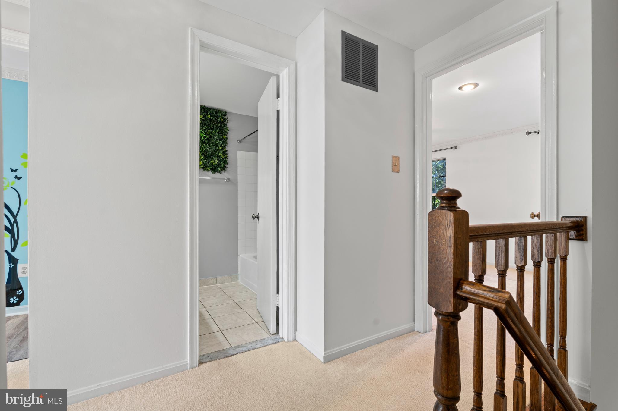 14801 Hammersmith Circle Silver Spring, MD 20906 - Photo 16 of 29 a view of a hallway with wooden floor and staircase