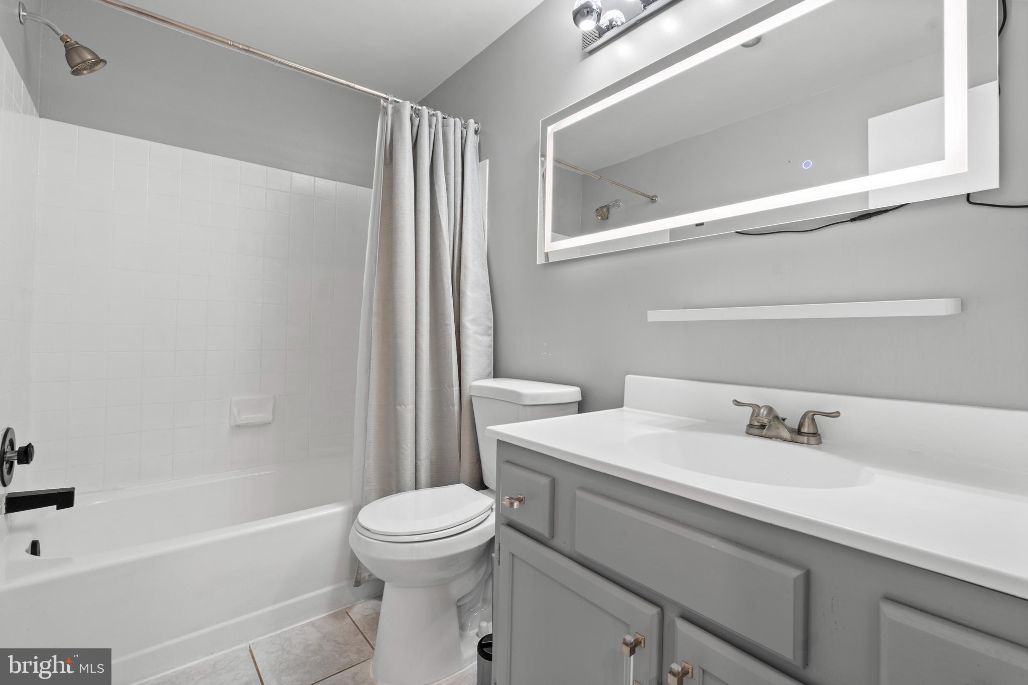 14801 Hammersmith Circle Silver Spring, MD 20906 - Photo 19 of 29 a bathroom with a sink toilet and shower