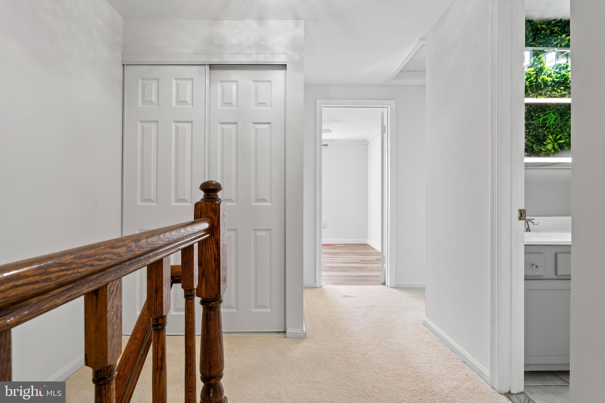 14801 Hammersmith Circle Silver Spring, MD 20906 - Photo 20 of 29 a view of a hallway with wooden floor and staircase