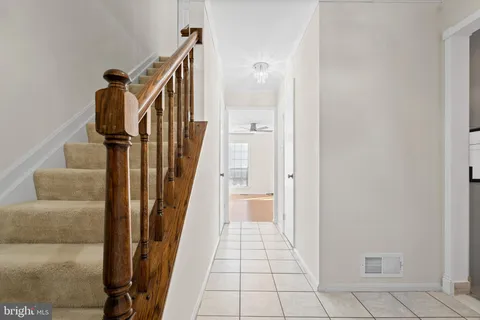 a view of a hallway view with staircase
