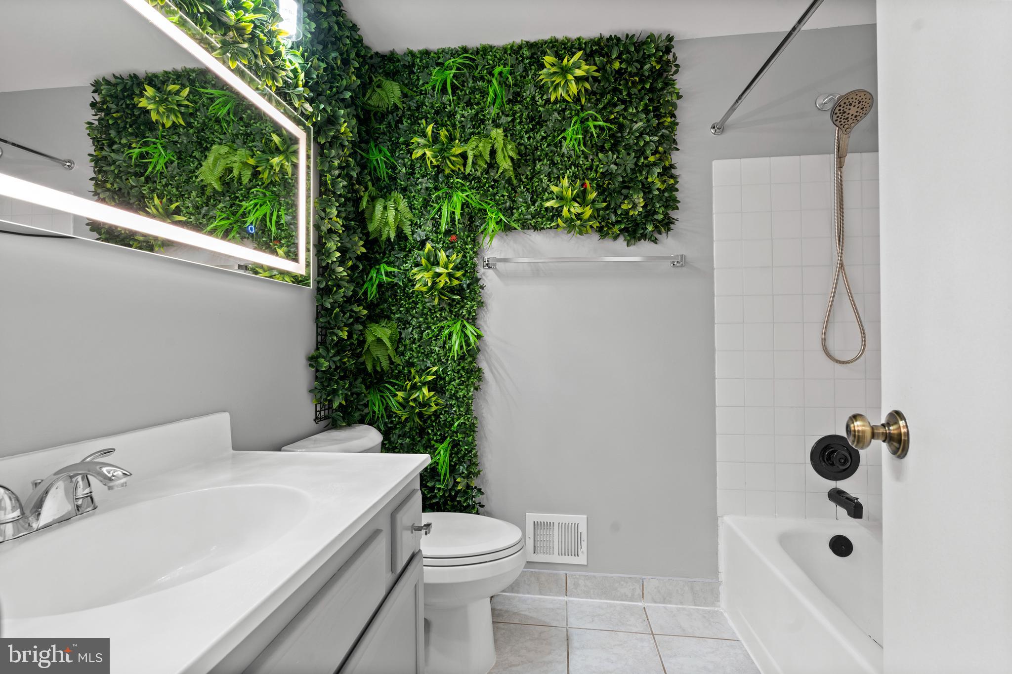 14801 Hammersmith Circle Silver Spring, MD 20906 - Photo 21 of 29 a white toilet sitting next to a bathroom sink