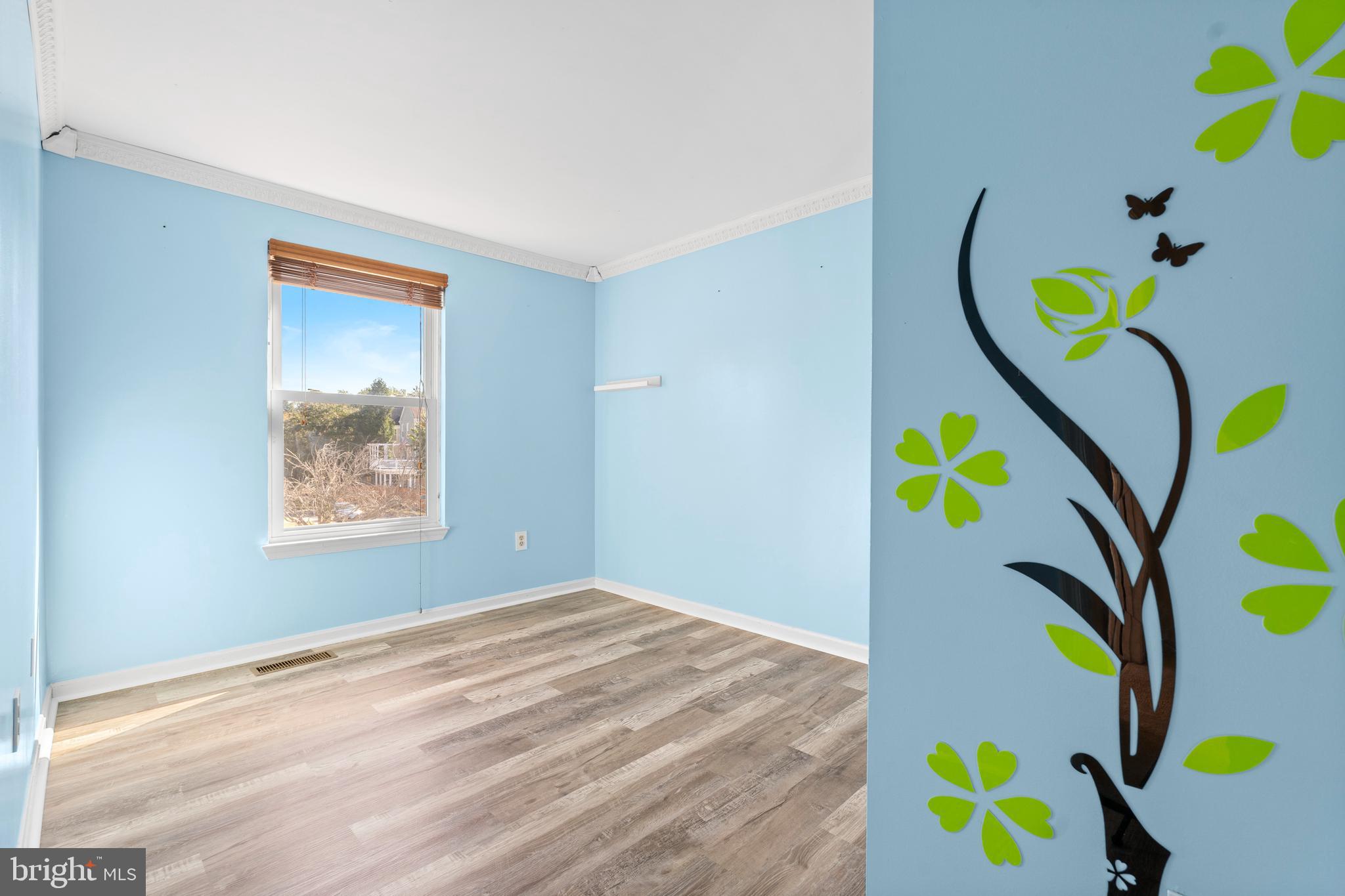 14801 Hammersmith Circle Silver Spring, MD 20906 - Photo 24 of 29 a bedroom with a bed and a painting on the wall