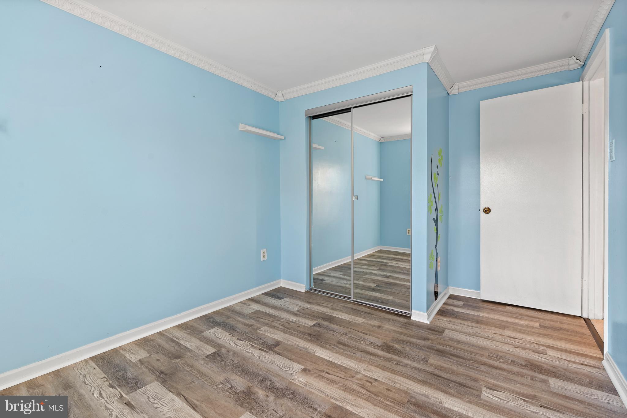 14801 Hammersmith Circle Silver Spring, MD 20906 - Photo 25 of 29 a view of a room with wooden floor and staircase