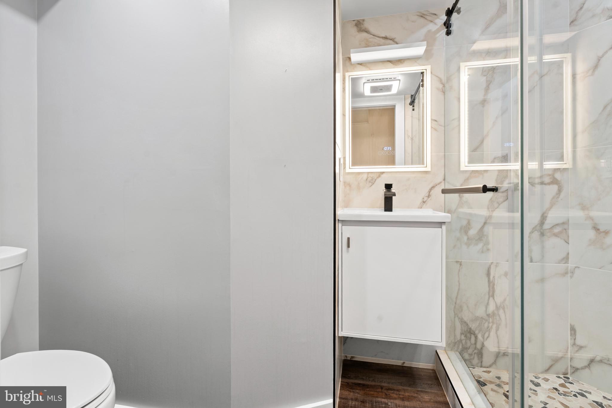 14801 Hammersmith Circle Silver Spring, MD 20906 - Photo 28 of 29 a bathroom with a sink and a mirror