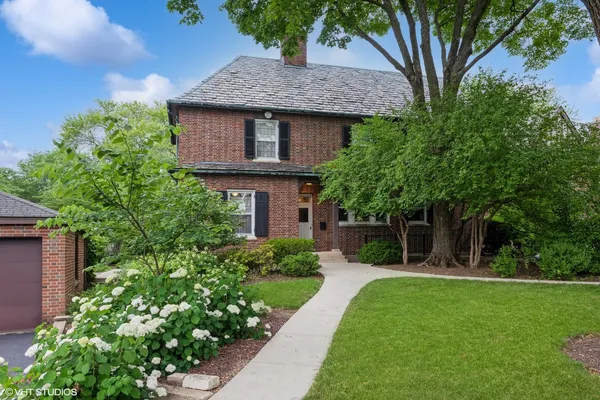 a view of a house with a garden