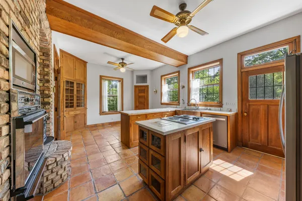 a kitchen with a stove and a sink