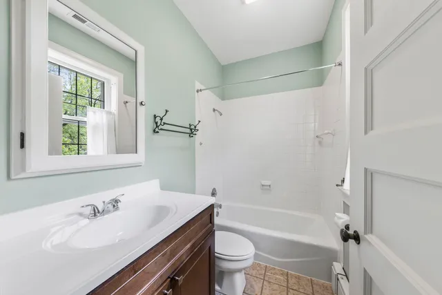 a bathroom with a sink a toilet and a bathtub