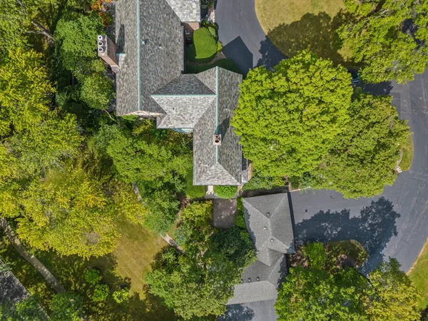 an aerial view of a house with a yard and garden