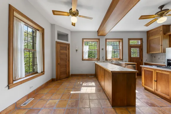 a view of a kitchen with a sink and microwave