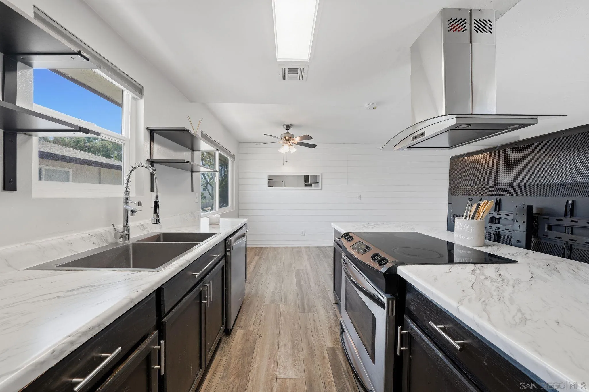 9926 Mission Vega Road, Unit 4 Santee, CA 92071 - Photo 14 of 30 a kitchen with stainless steel appliances granite countertop a sink stove and cabinets