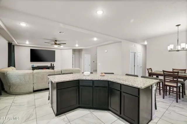 a kitchen with a sink and white cabinets
