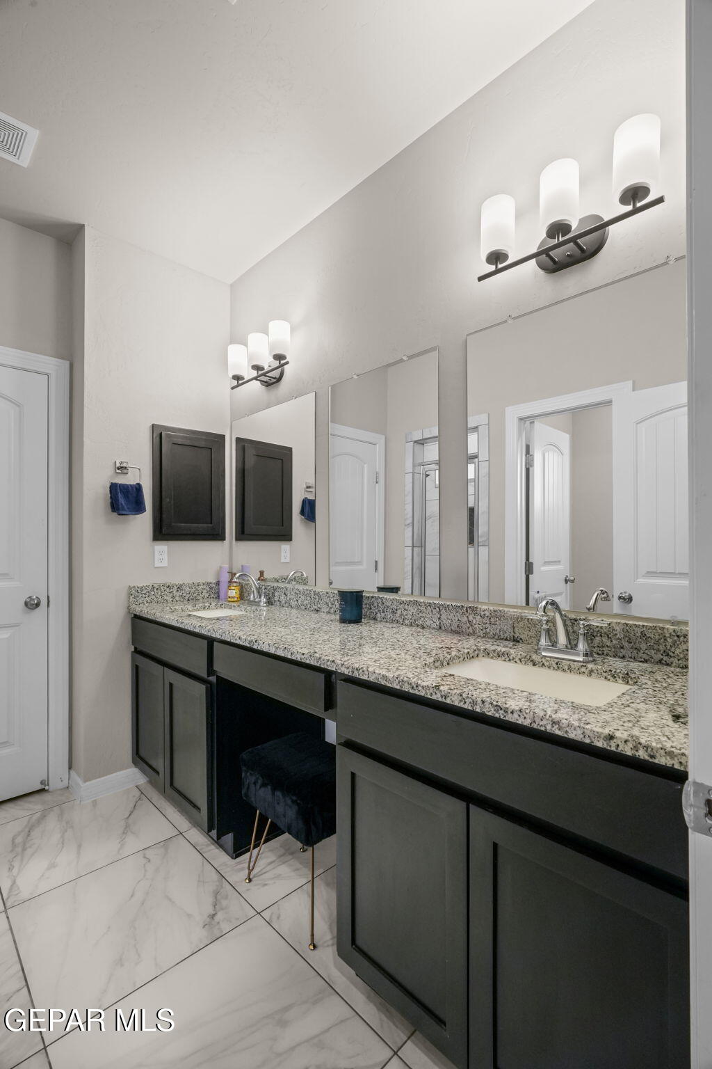 356 Plateau Drive Socorro, TX 79927 - Photo 21 of 51 a bathroom with a sink and a mirror