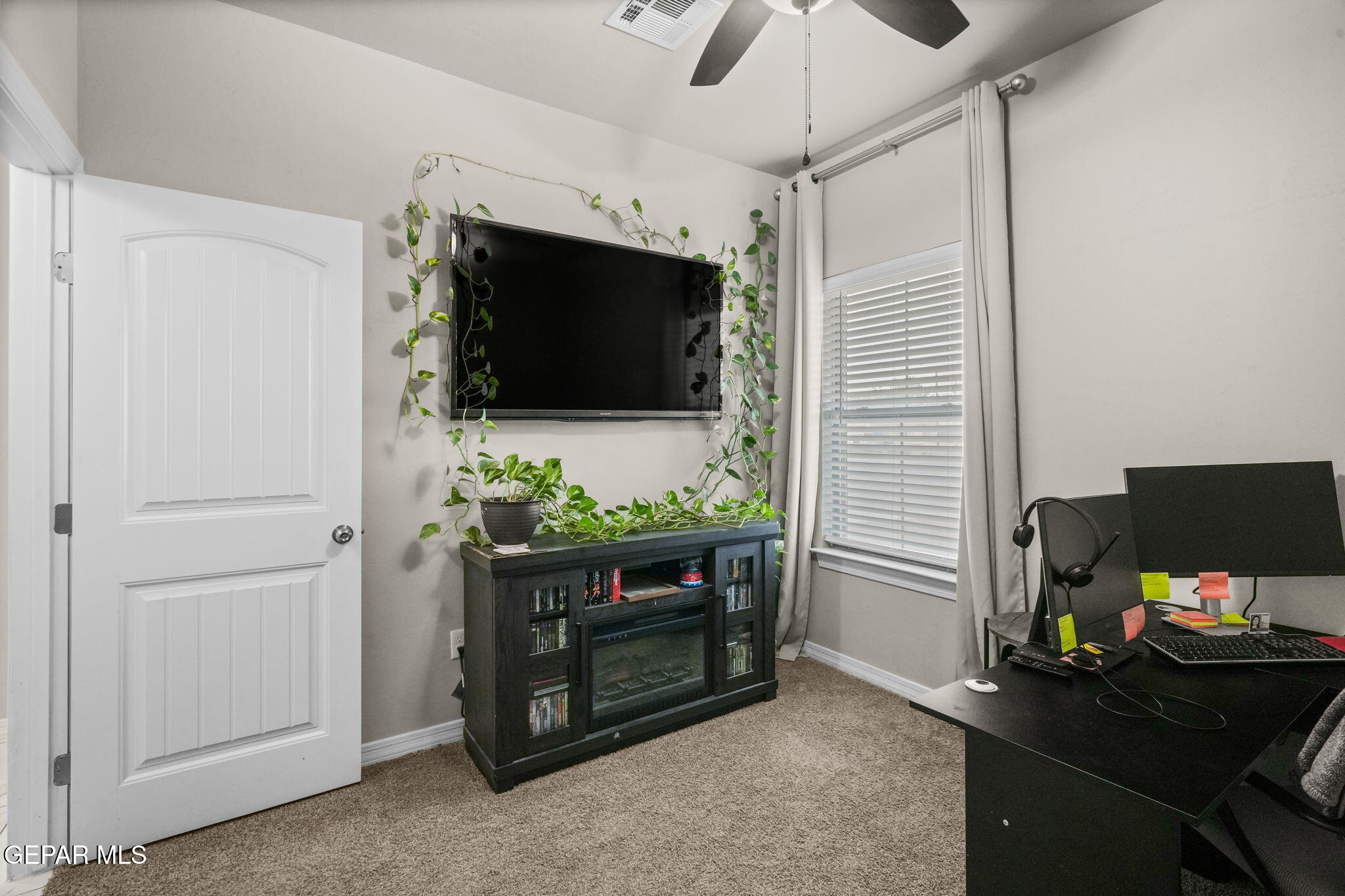 356 Plateau Drive Socorro, TX 79927 - Photo 32 of 51 a room with furniture and flat screen tv