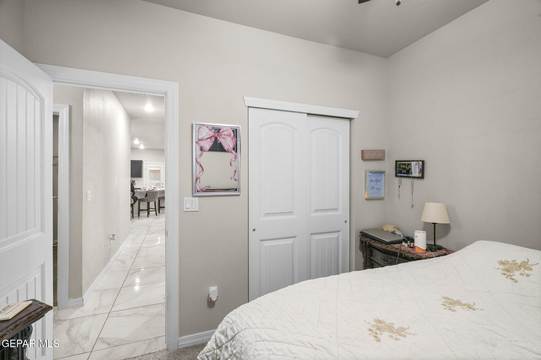 356 Plateau Drive Socorro, TX 79927 - Photo 34 of 51 a bedroom with a bed and wooden floor