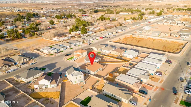 an aerial view of residential houses with outdoor space
